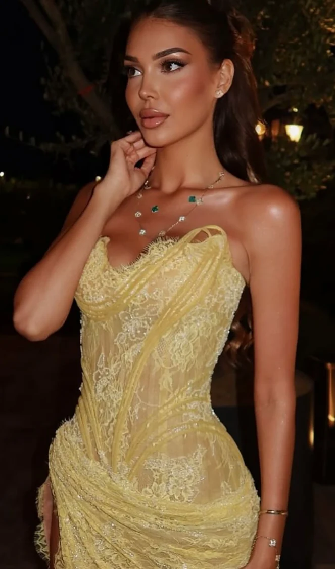 Close-up of an intricately embroidered gold occasion gown